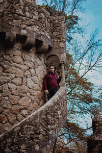 Full length of man standing on rock