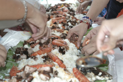 Close-up of man preparing food