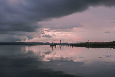 Scenic view of sea against sky at sunset