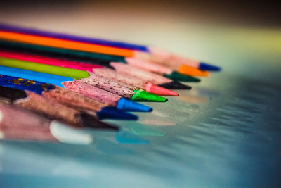 Close-up of colored pencils on table