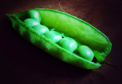 Close-up of green fruits on table