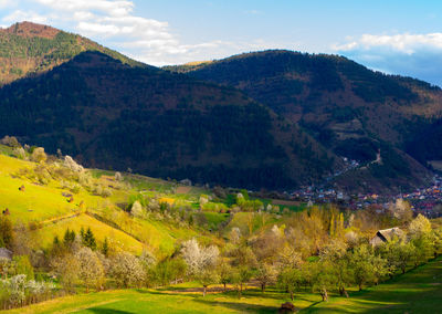 Scenic view of landscape and mountains against sky