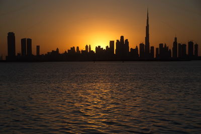 Dubai slyline from dubai creek harbour and dubai canal to downtown and business bay, uae