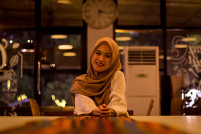 Portrait of smiling woman at restaurant