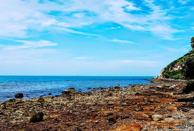 Scenic view of sea against blue sky