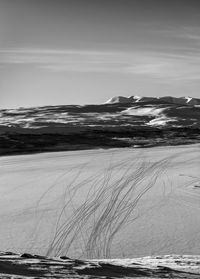 Scenic view of sea against sky during winter