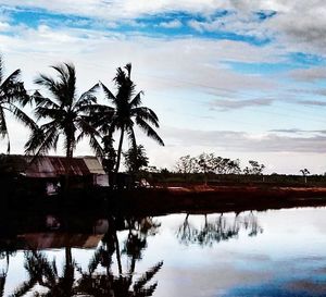 Scenic view of lake against cloudy sky