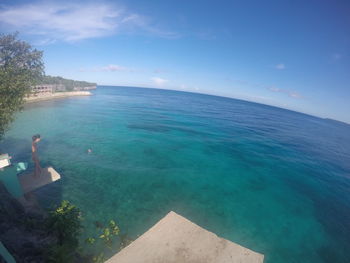 Scenic view of sea against blue sky