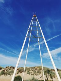 Low angle view of communications tower against sky