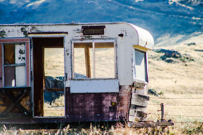 Old abandoned truck on field