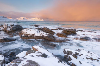 Scenic view of sea against sky during winter