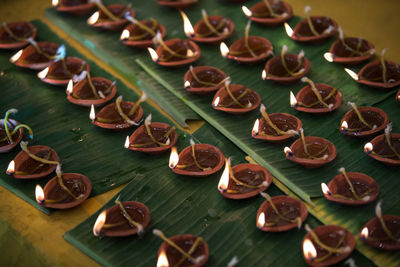 Oil lamp offering to the goddess at durga puja pandal