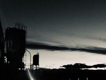 Silhouette of building against sky during sunset