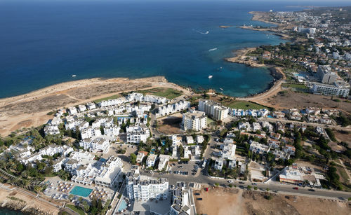 High angle view of townscape by sea