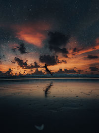 Scenic view of silhouette at night during sunset