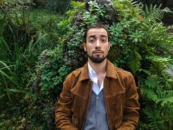 Portrait of a young man in forest