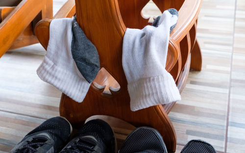 Close-up of socks hanging on furniture