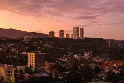 High angle view of buildings against sky during sunset