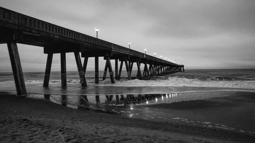 Pier over sea against sky