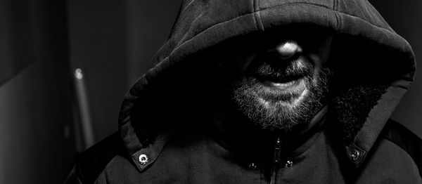 Close-up portrait of man wearing mask