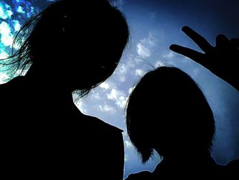 Low angle view of woman against clear sky