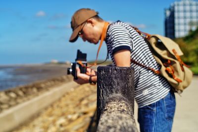 Side view of man working at beach