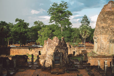 High angle view of old temples and trees against sky