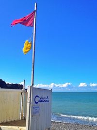 View of beach against blue sky