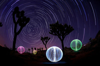 Light painting against sky at night