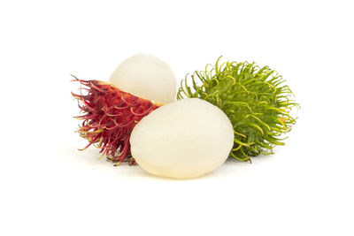 Close-up of fruits against white background