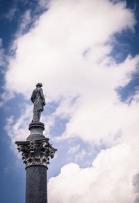 Low angle view of statue against sky
