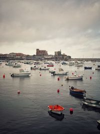 Boats in sea against sky