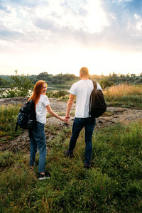 Local travel, solo explorers, small group tourist. young couple going for hiking, walk in nature. 