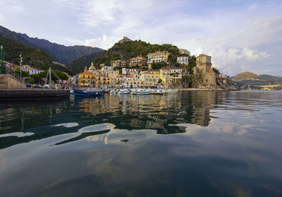 Scenic view of sea and buildings against sky