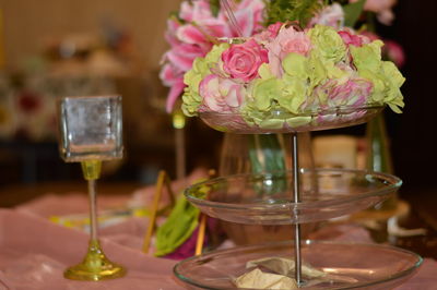 Close-up of rose in glass vase on table