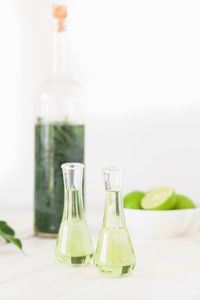 Close-up of glasses on table against white background