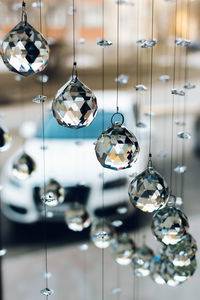 Close-up of illuminated pendant lights hanging from ceiling