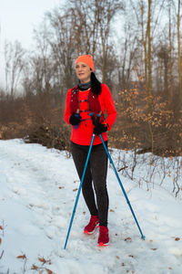 Full length portrait of girl on snow field