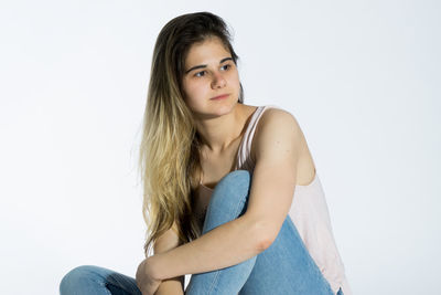 Portrait of a beautiful young woman over white background