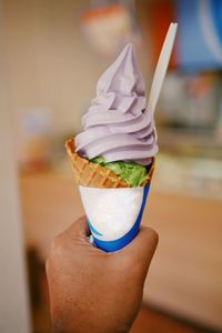 Midsection of person holding ice cream