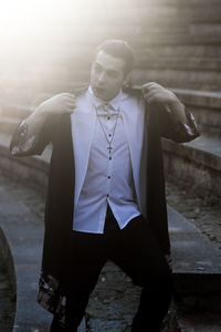 Full length of young man looking at camera