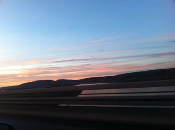 Scenic view of mountains at sunset