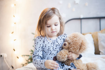 Portrait of cute girl with toy