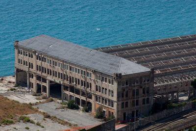 High angle view of building by sea in city