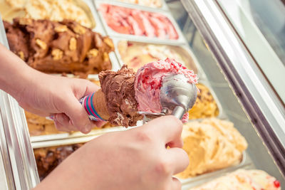 Hand holding ice cream cone