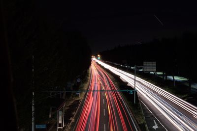 High angle view of light trails on street at night