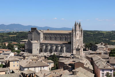 Panoramic view of buildings in city against sky