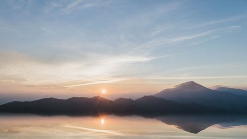 Scenic view of mountains against sky during sunset