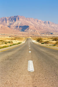 Road leading towards mountains