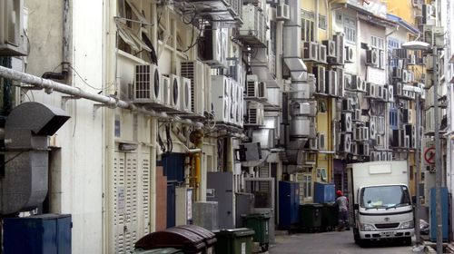 Cars on road amidst buildings in city